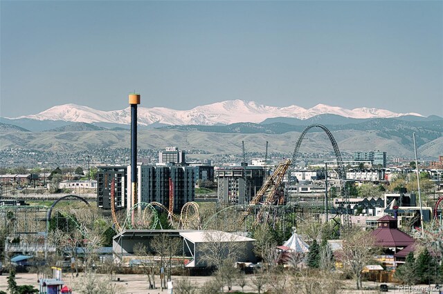 property's view of city featuring a mountain view
