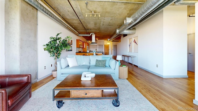 1401 Wewatta St Unit 808, Denver, CO 80202 - living area featuring light wood-style floors and baseboards