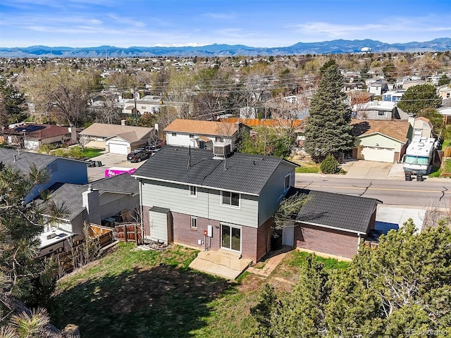 drone / aerial view with a mountain view and a residential view