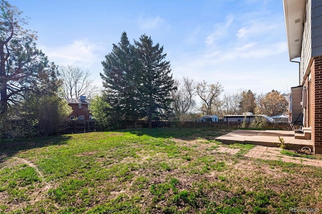 view of yard with a patio and fence