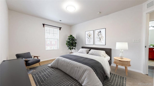 bedroom featuring visible vents, baseboards, and carpet flooring