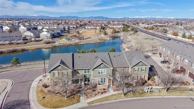 aerial view featuring a residential view and a water and mountain view