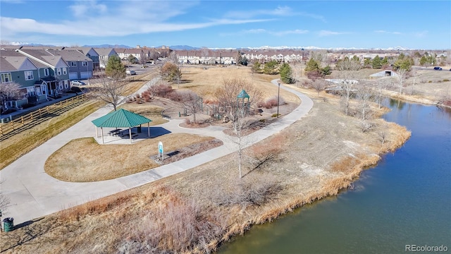 bird's eye view featuring a residential view and a water view