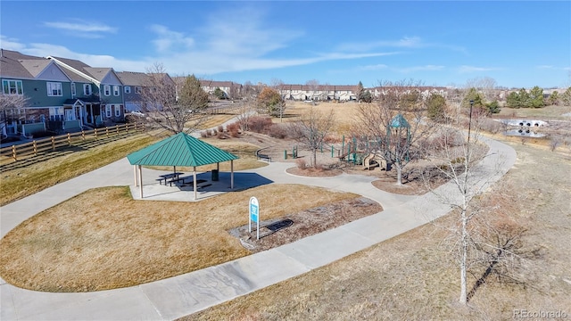 surrounding community featuring a gazebo, a residential view, and fence