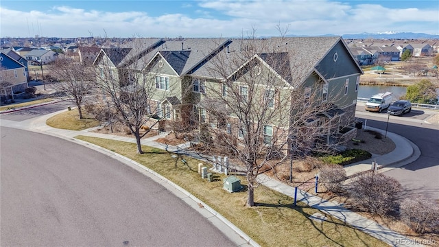 view of front of house featuring a residential view and driveway