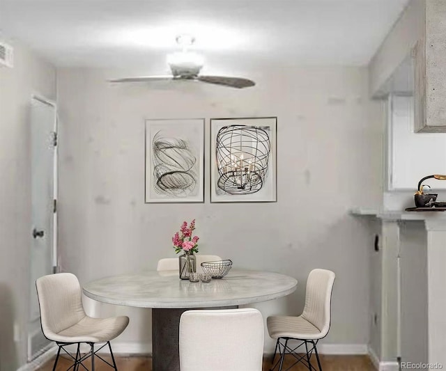 dining area featuring baseboards