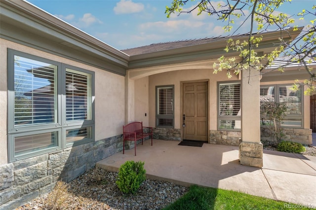 doorway to property with a patio