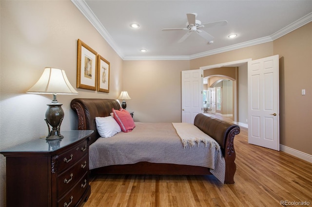 bedroom featuring ceiling fan, crown molding, and light wood-type flooring