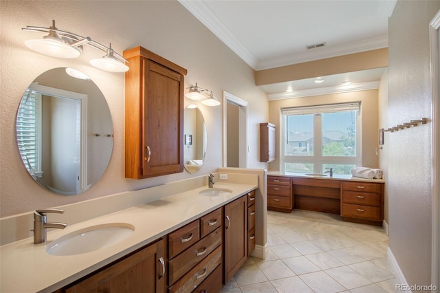 bathroom featuring vanity, crown molding, and tile patterned flooring