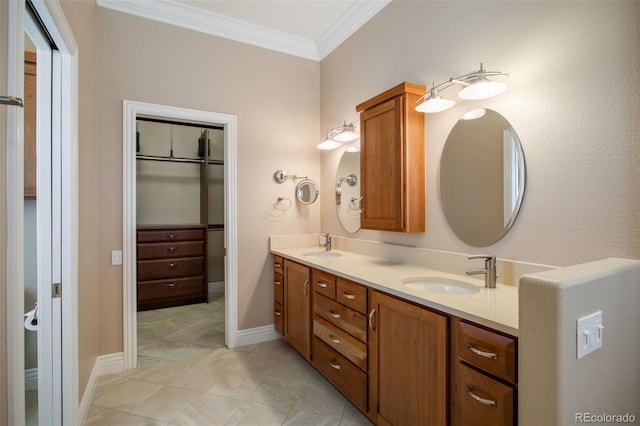 bathroom with crown molding and vanity