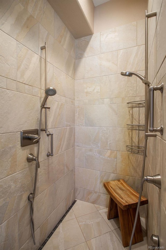 bathroom with tiled shower