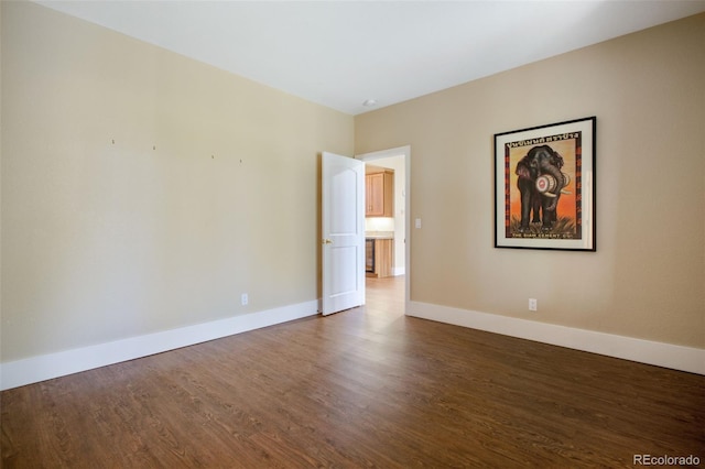 empty room featuring dark hardwood / wood-style floors