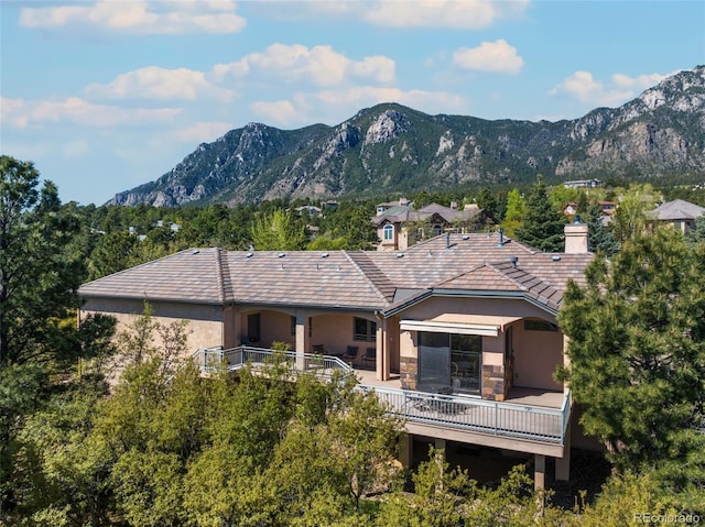 rear view of house with a mountain view