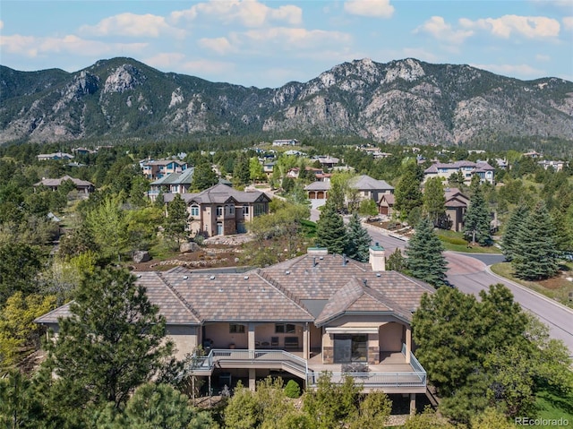 birds eye view of property featuring a mountain view