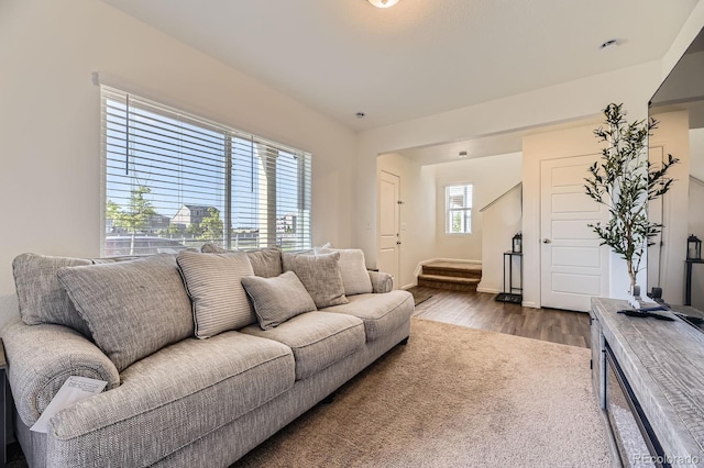 18270 E 51st Pl, Denver, CO 80249 - living area featuring dark wood finished floors, stairway, and baseboards