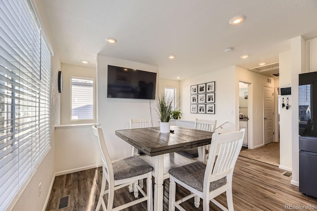 18270 E 51st Pl, Denver, CO 80249 - dining room with wood finished floors, plenty of natural light, recessed lighting, and baseboards