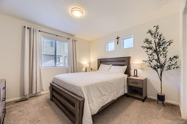 18270 E 51st Pl, Denver, CO 80249 - bedroom featuring light colored carpet, multiple windows, and baseboards