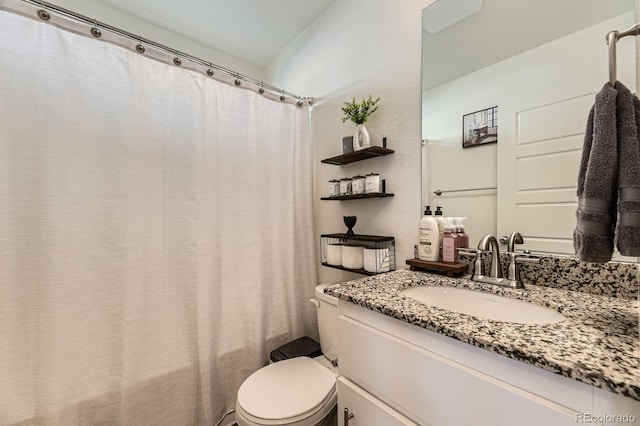 18270 E 51st Pl, Denver, CO 80249 - bathroom featuring vanity, toilet, and shower / bath combo with shower curtain