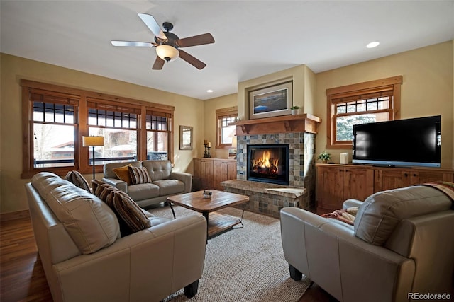 living area with recessed lighting, wood finished floors, a fireplace, and ceiling fan