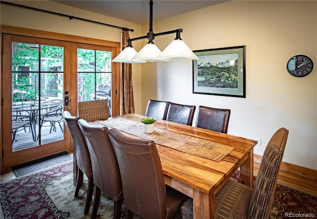 dining space featuring french doors