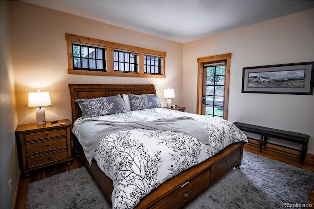 bedroom featuring dark wood finished floors