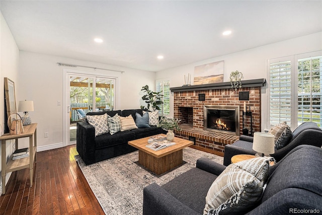 10247 W Roxbury Pl, Littleton, CO 80127 - living room with hardwood / wood-style floors, recessed lighting, baseboards, and a brick fireplace