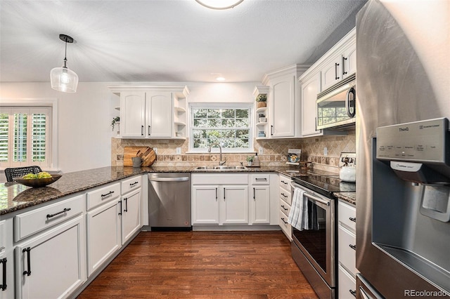 10247 W Roxbury Pl, Littleton, CO 80127 - kitchen with stainless steel appliances, open shelves, a sink, and white cabinetry