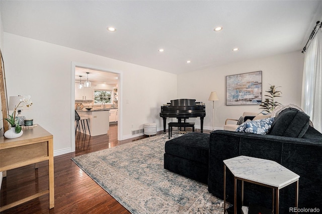 10247 W Roxbury Pl, Littleton, CO 80127 - living room with recessed lighting, dark wood finished floors, and baseboards