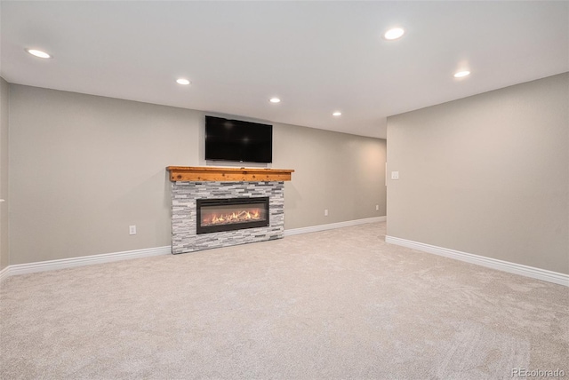 10247 W Roxbury Pl, Littleton, CO 80127 - unfurnished living room featuring carpet, recessed lighting, a stone fireplace, and baseboards