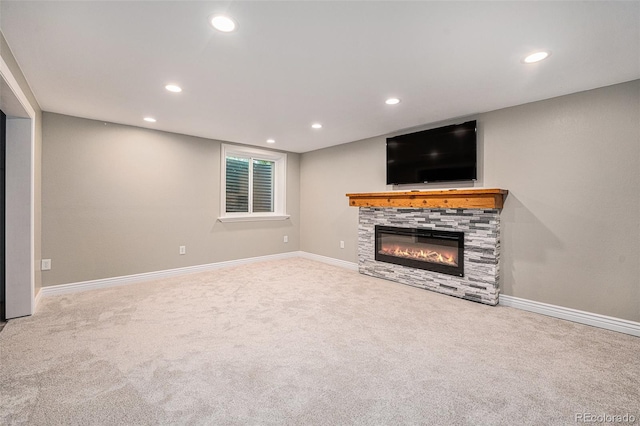 10247 W Roxbury Pl, Littleton, CO 80127 - unfurnished living room featuring recessed lighting, carpet floors, a fireplace, and baseboards