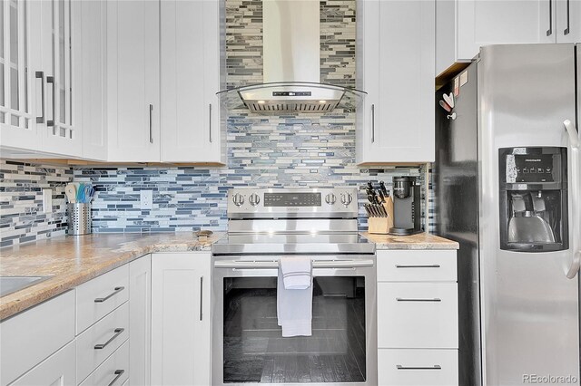 700 Rosalie Rd, Bailey, CO 80421 - kitchen featuring stainless steel appliances, exhaust hood, tasteful backsplash, white cabinetry, and light stone countertops