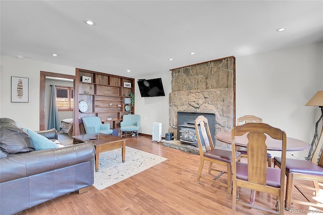 700 Rosalie Rd, Bailey, CO 80421 - living area featuring wood finished floors, a fireplace, and recessed lighting