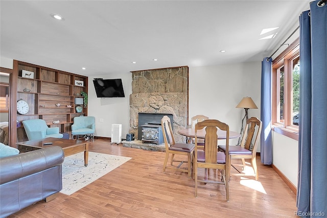 700 Rosalie Rd, Bailey, CO 80421 - living room with light wood-style floors, baseboards, recessed lighting, and a fireplace