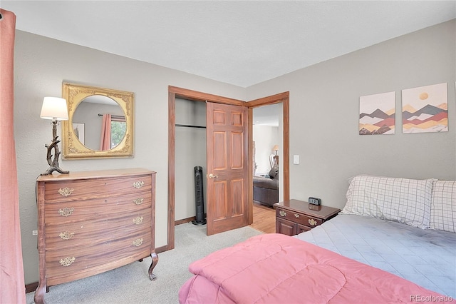 700 Rosalie Rd, Bailey, CO 80421 - bedroom featuring light carpet, baseboards, and a closet