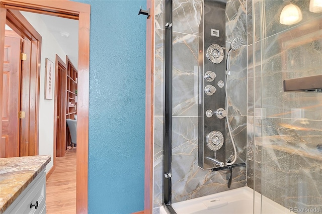 700 Rosalie Rd, Bailey, CO 80421 - full bath with a stall shower, vanity, wood finished floors, and a textured wall