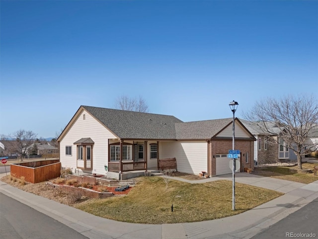 single story home with a shingled roof, a front lawn, a porch, a garage, and driveway