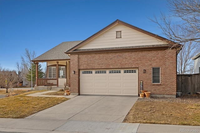 view of front of home with driveway, brick siding, an attached garage, and a shingled roof