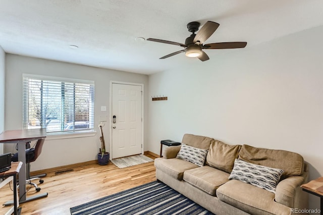 3061 W 18th Ave, Denver, CO 80204 - living area with light wood-style floors, baseboards, and a ceiling fan