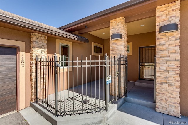 view of gate with fence