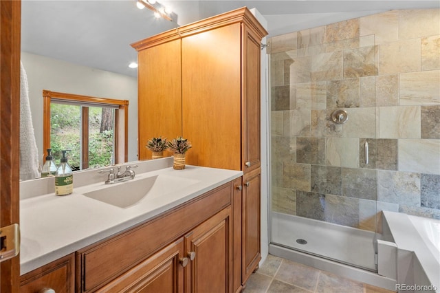 full bath with vanity and a stall shower