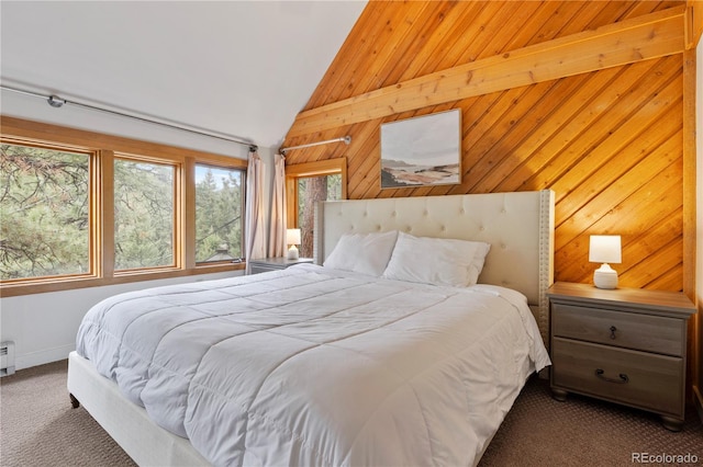 bedroom with carpet floors, wood walls, and lofted ceiling