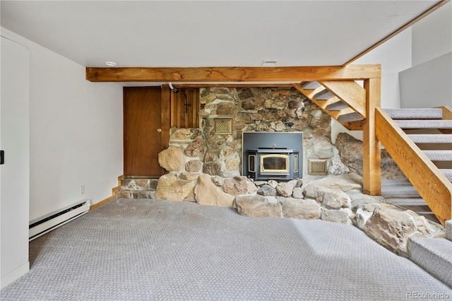 unfurnished living room featuring carpet flooring, baseboard heating, a wood stove, beamed ceiling, and stairway