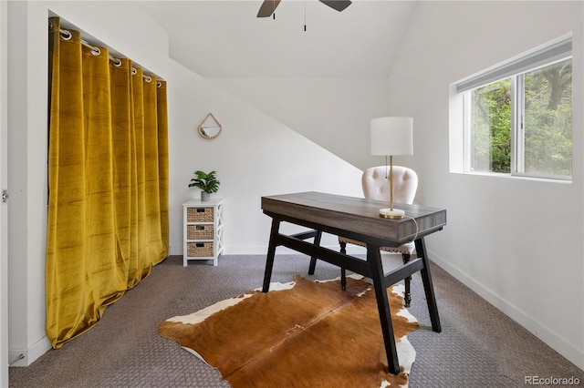 home office featuring baseboards, carpet flooring, a ceiling fan, and vaulted ceiling