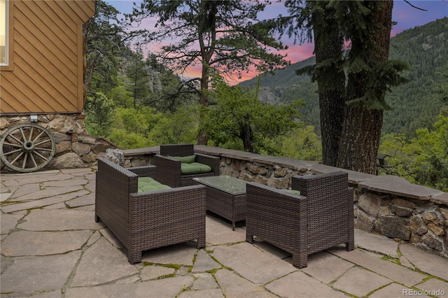 patio terrace at dusk with an outdoor living space