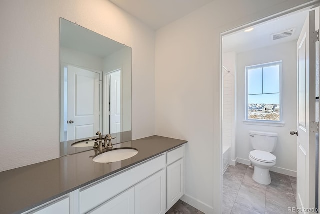 full bathroom with vanity, tub / shower combination, and toilet