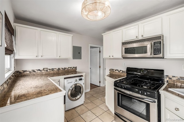 1800 Grove St, Denver, CO 80204 - kitchen featuring appliances with stainless steel finishes, washer / dryer, electric panel, white cabinets, and light tile patterned floors