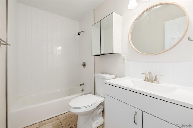 1800 Grove St, Denver, CO 80204 - bathroom featuring toilet, vanity, and  shower combination