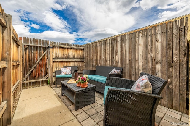 1800 Grove St, Denver, CO 80204 - fenced backyard featuring outdoor lounge area, a patio area, and a gate