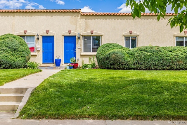 1800 Grove St, Denver, CO 80204 - mediterranean / spanish-style home with a front lawn and stucco siding