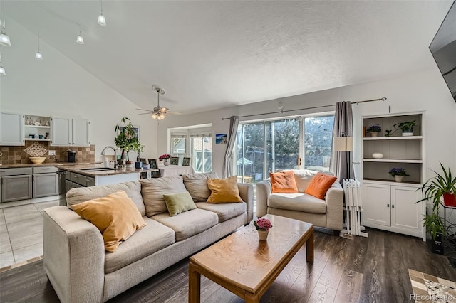 10064 Owens St, Broomfield, CO 80021 - living area featuring ceiling fan, wood finished floors, and high vaulted ceiling